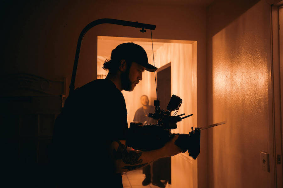 Camera operator in warm light